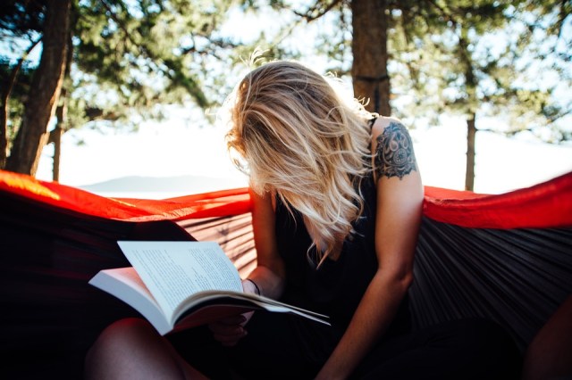 woman reading in hammock